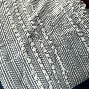 Twin size comforter with pillow sham and sheet set.